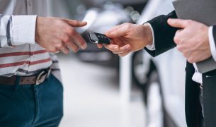 Female hands close up with car keys